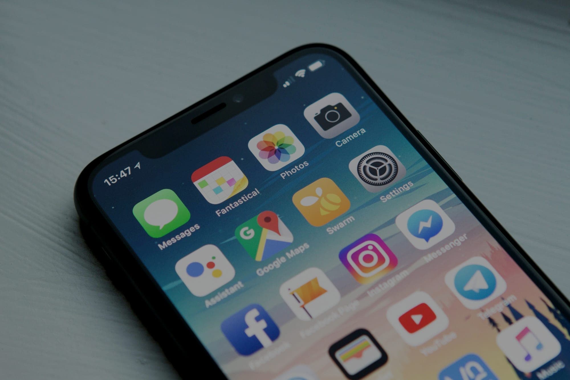 The top corner of an iPhone home screen showing Messages, Photos, Camera, Google Maps, Instagram and other app icons