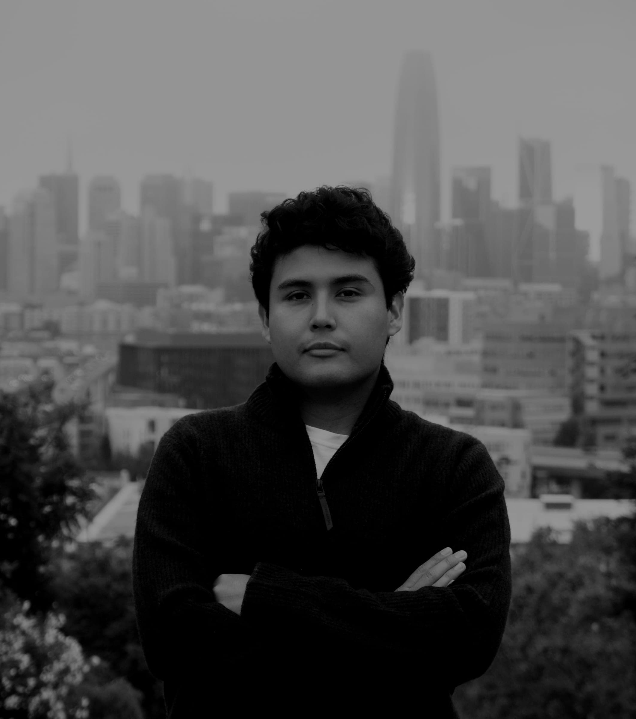 Black and white portrait of Jeffrey Escobar, founder and CTO of House AI, with the San Francisco skyline behind him