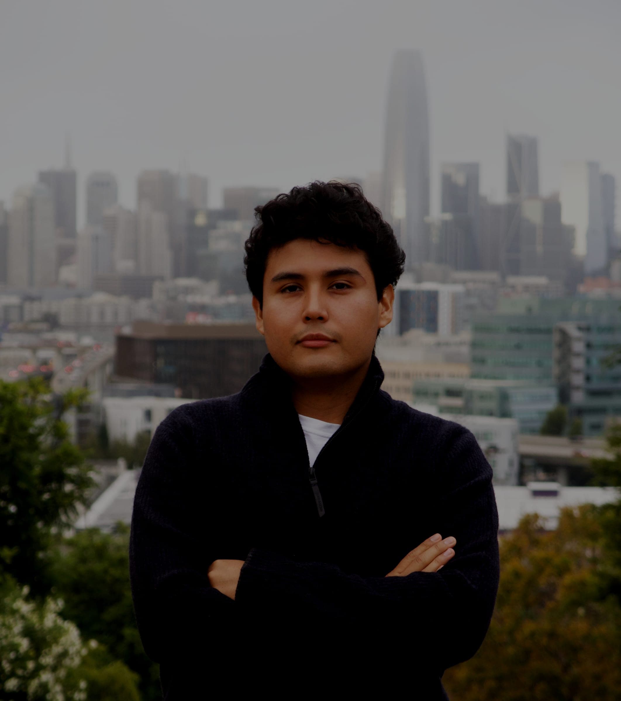 Jeffrey Escobar, founder and CTO of House AI, with the San Francisco skyline behind him