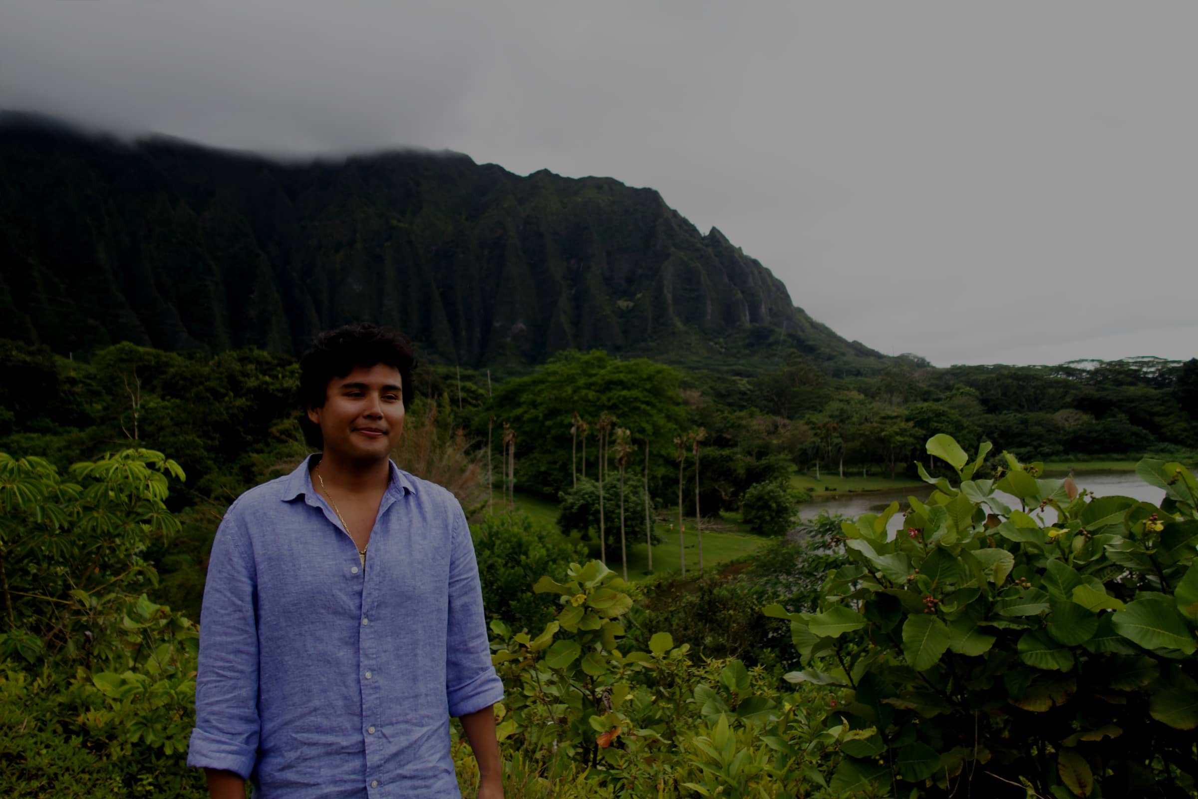 Jeffrey Escobar in front of the Ko'olau Mountains at Ho'omaluhia Botanical Garden in Kaneohe, Oahu, Hawaii