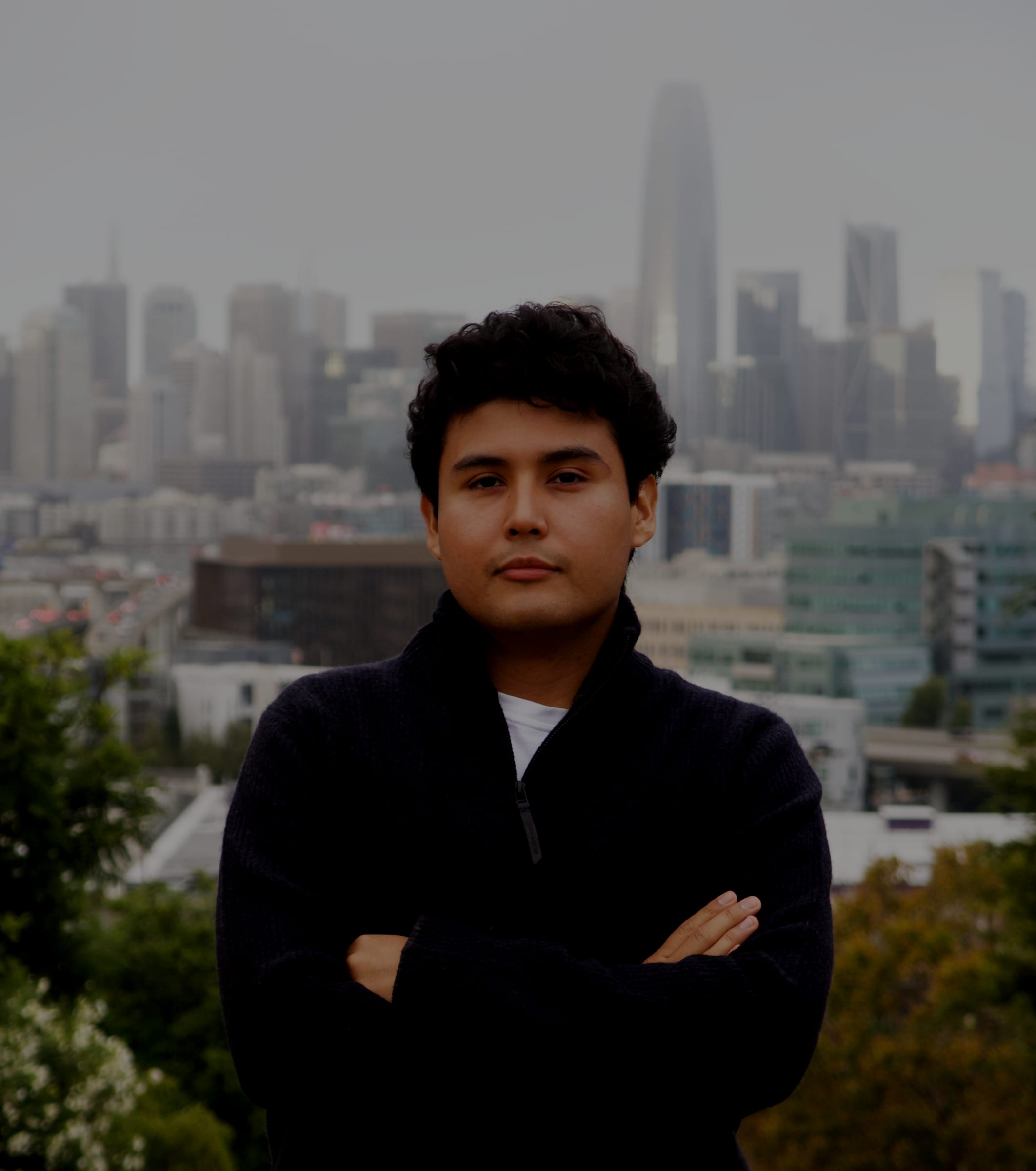 Jeffrey Escobar, co-founder and CTO of House AI, with the San Francisco skyline behind him