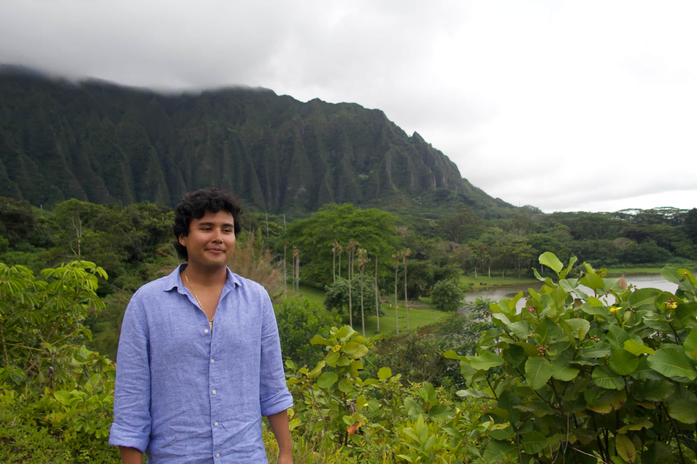 Jeffrey Escobar in front of the Ko'olau Mountains at Ho'omaluhia Botanical Garden in Kaneohe, Oahu, Hawaii