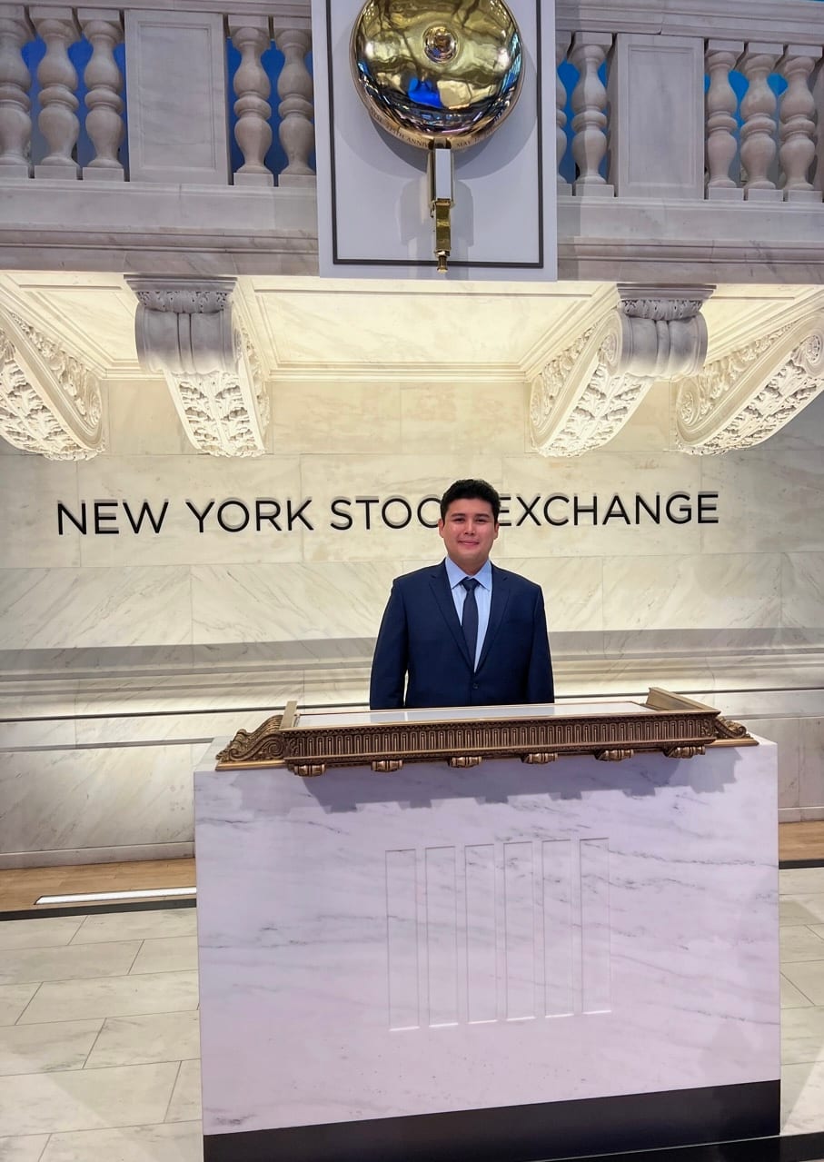 Jeffrey Escobar at the bell podium inside the New York Stock Exchange in May 2023